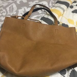 Reversible tote with pouch.